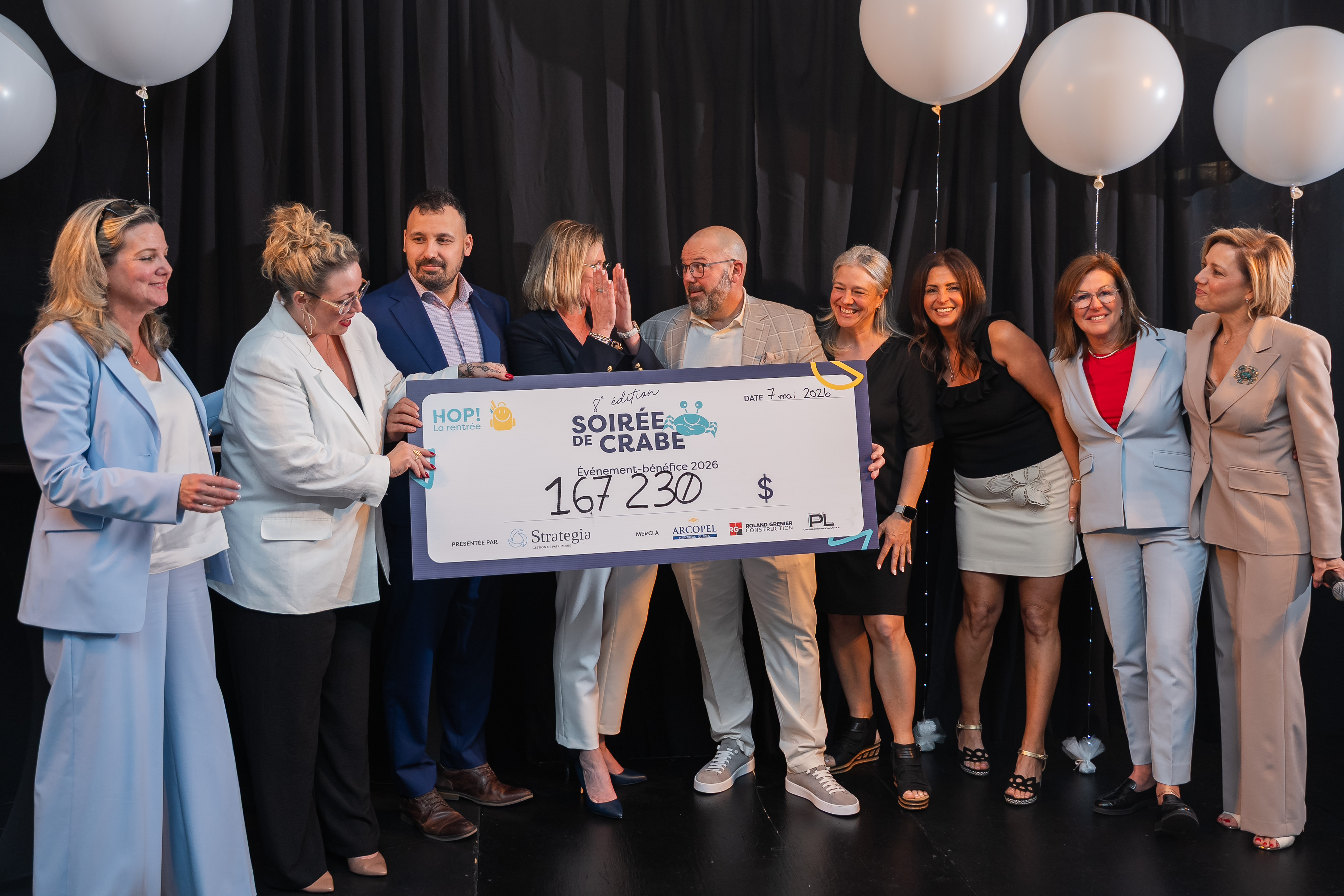 woman holding fundraiser cheque