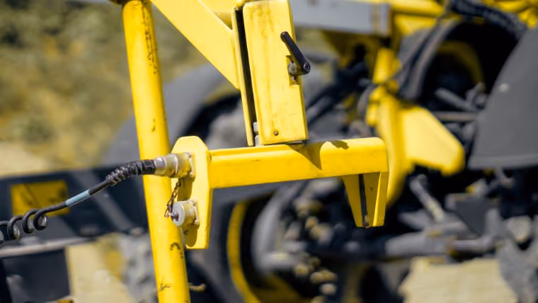 Sonic sensor bracket mounted on the grader blade