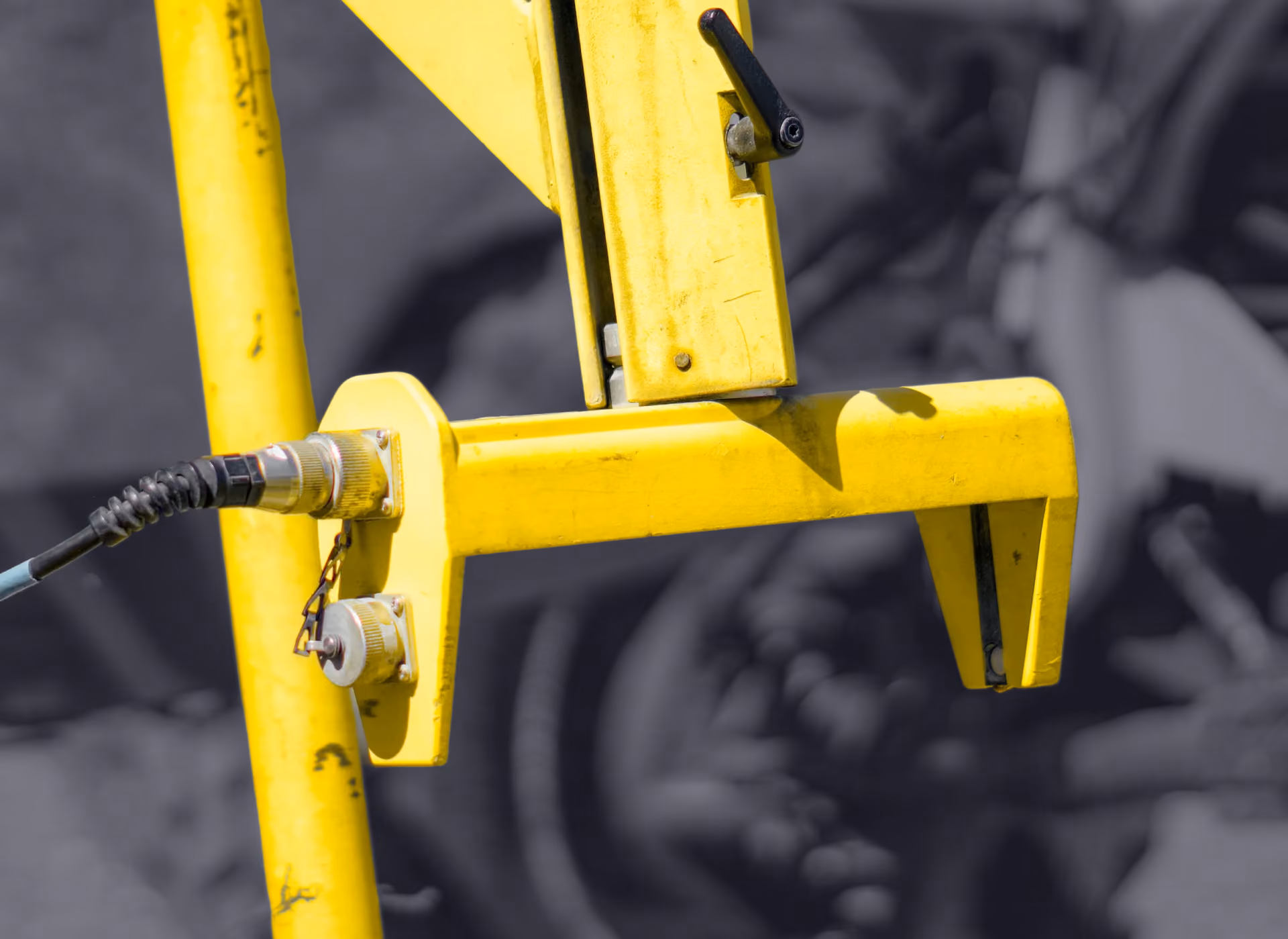 Sonic sensor bracket mounted on the grader blade