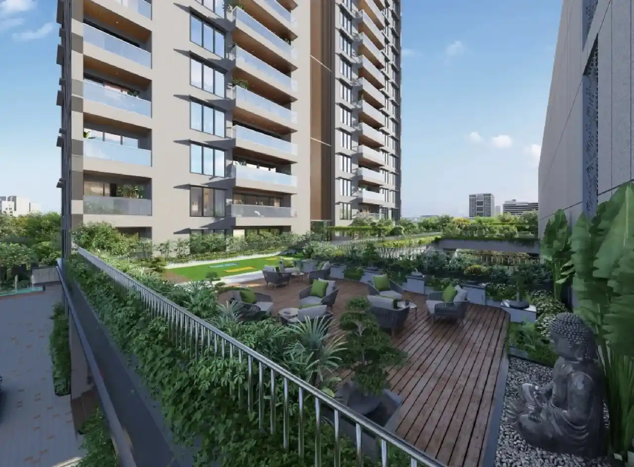 Concorde Eleve terrace: chairs, greenery, Buddha statue.