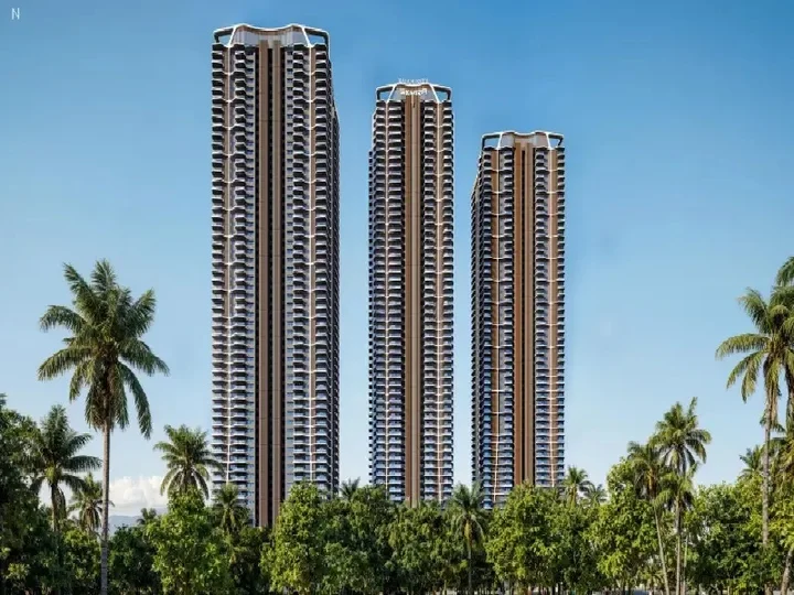 Three high-rise towers surrounded by greenery at Rajapushpa Skyra