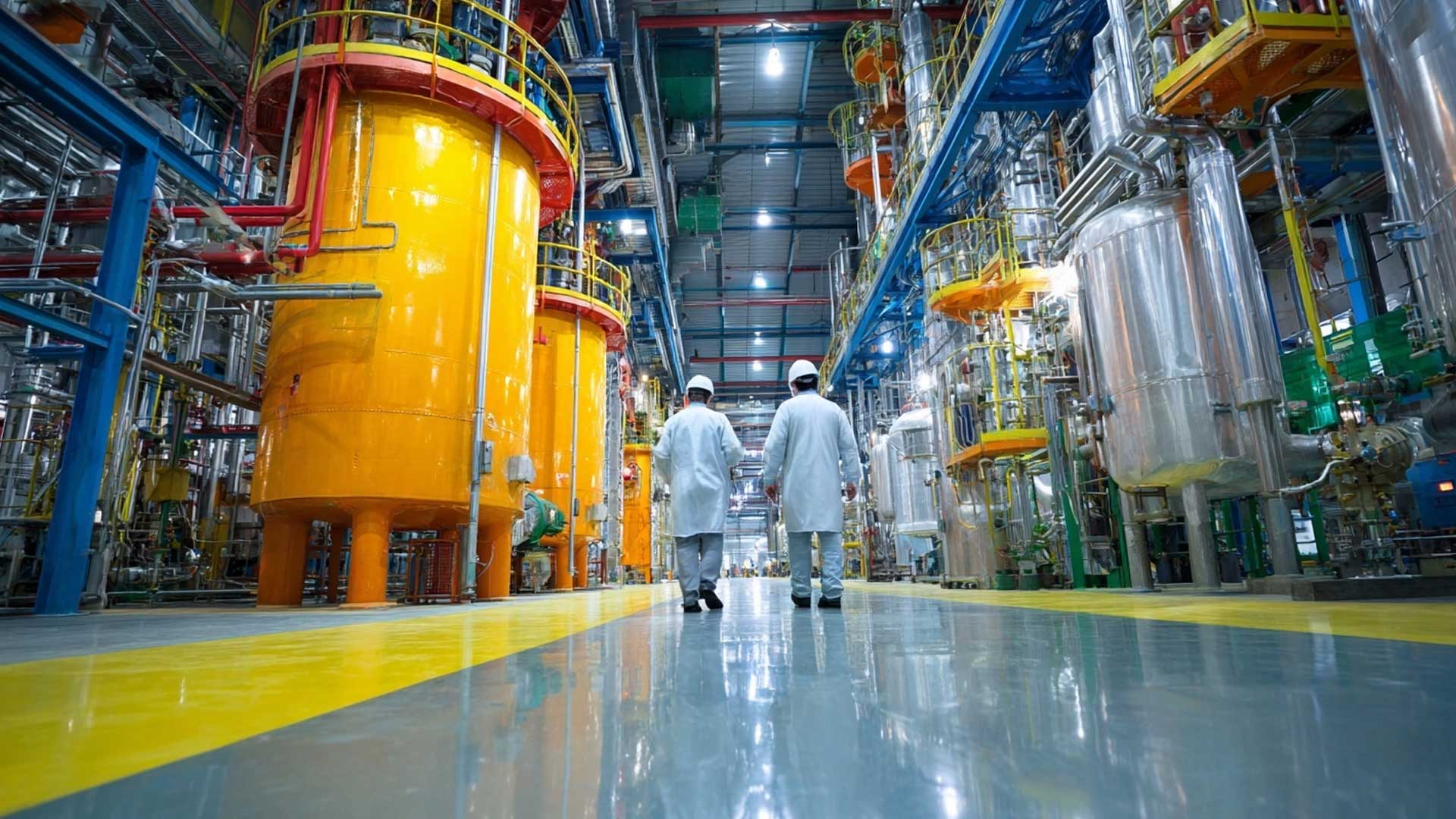 People on chemical factory floor