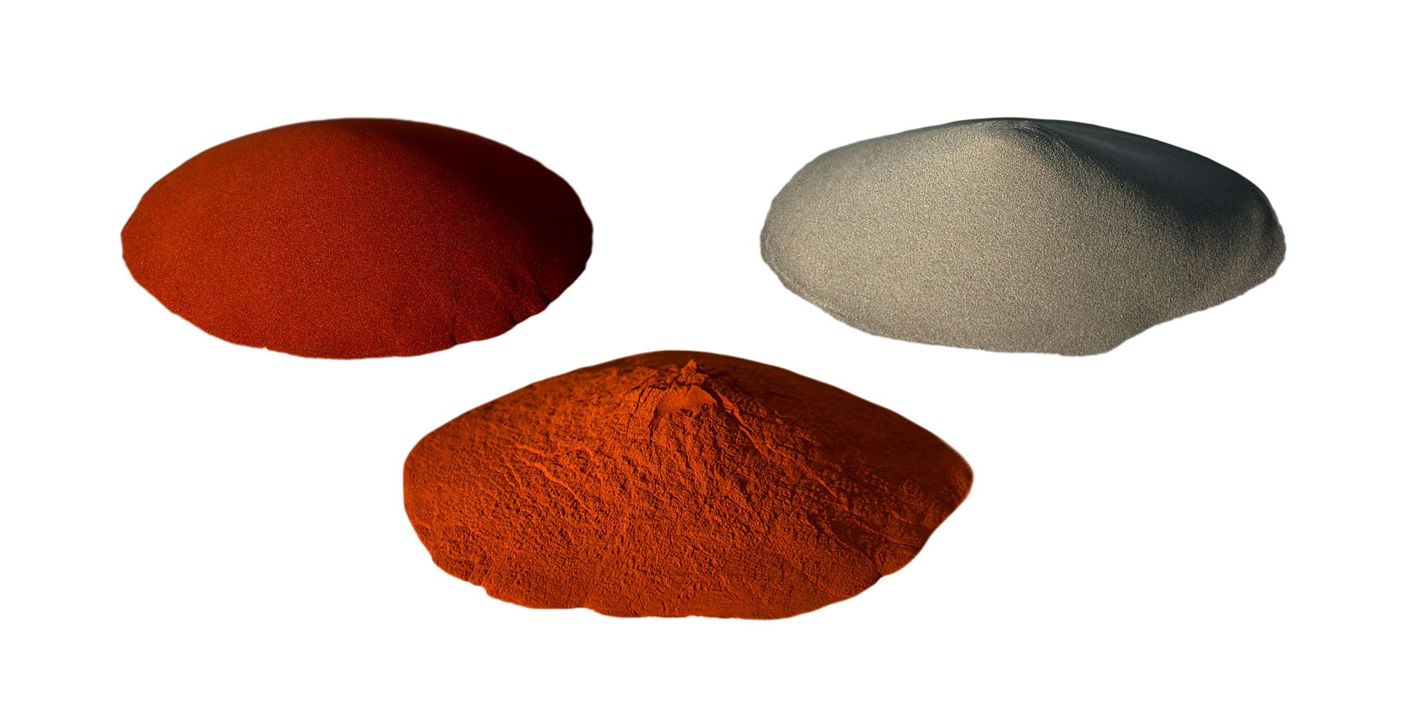 Three piles of extremely finely milled metal powders