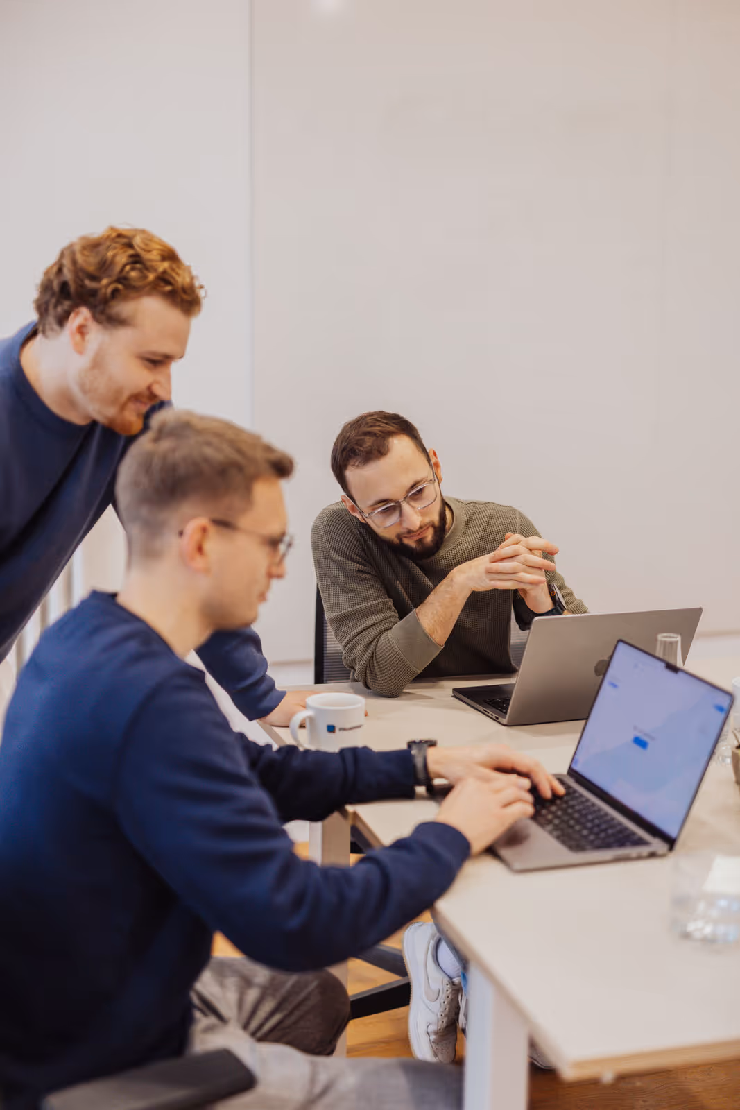 team looking at a laptop
