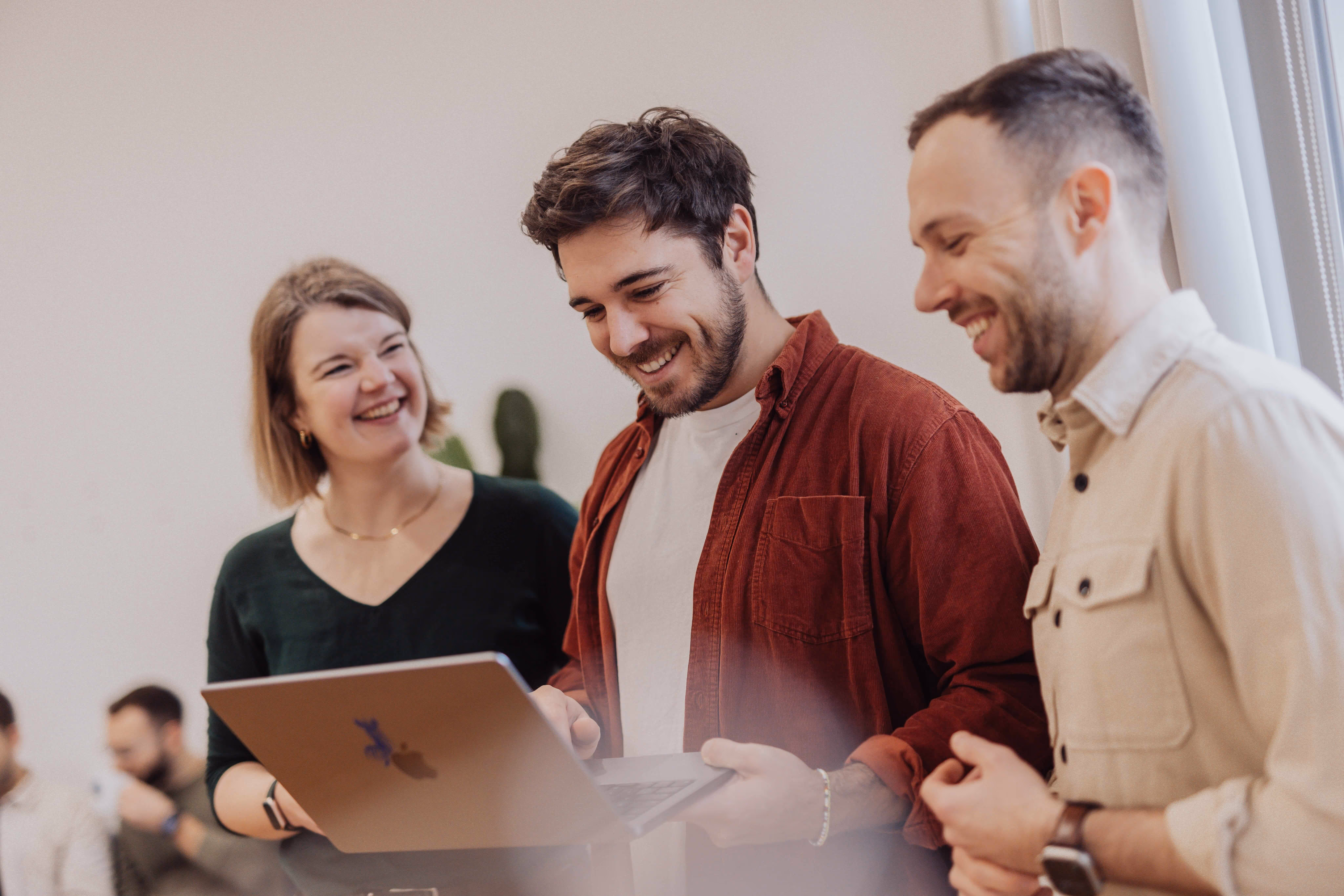 Visual Makers team members collaborating in the office