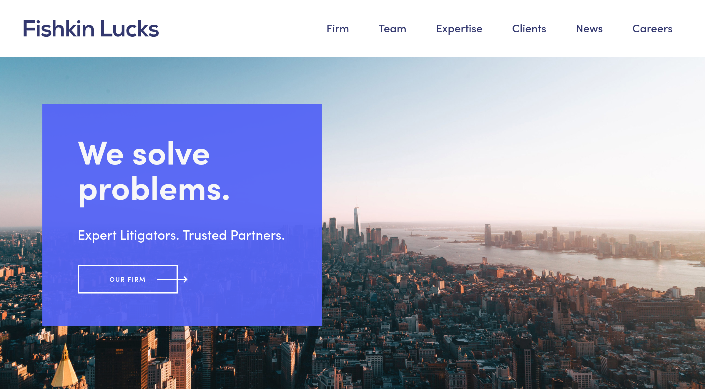 Fishkin Lucks Website Re-Design clean warm late day sun set on a nyc skyline, with a purplish blue box juxtaposed on top of it with a simple message: We Solve Problems.