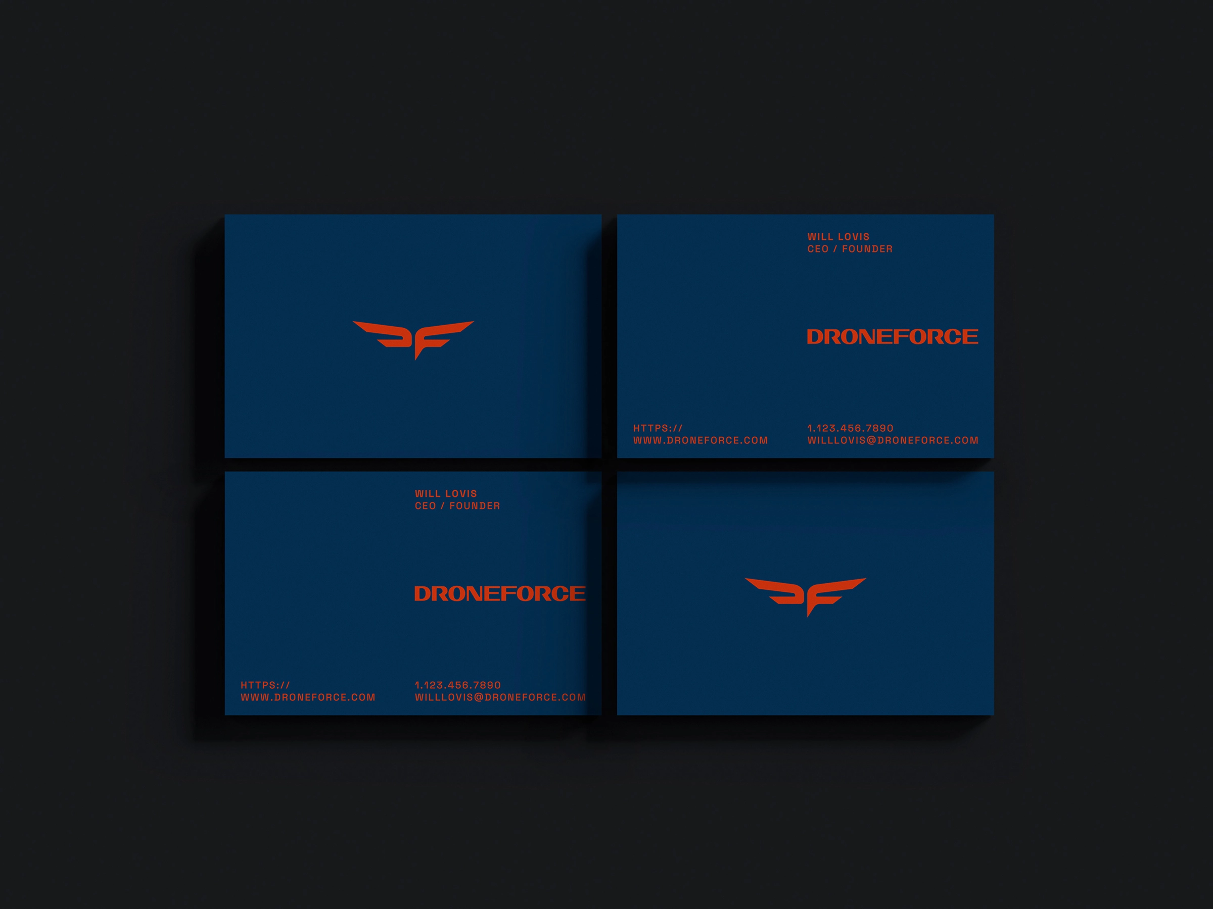 Business card mockups showing off red 'flame' colored logo and type on a rich 'aviation' blue background