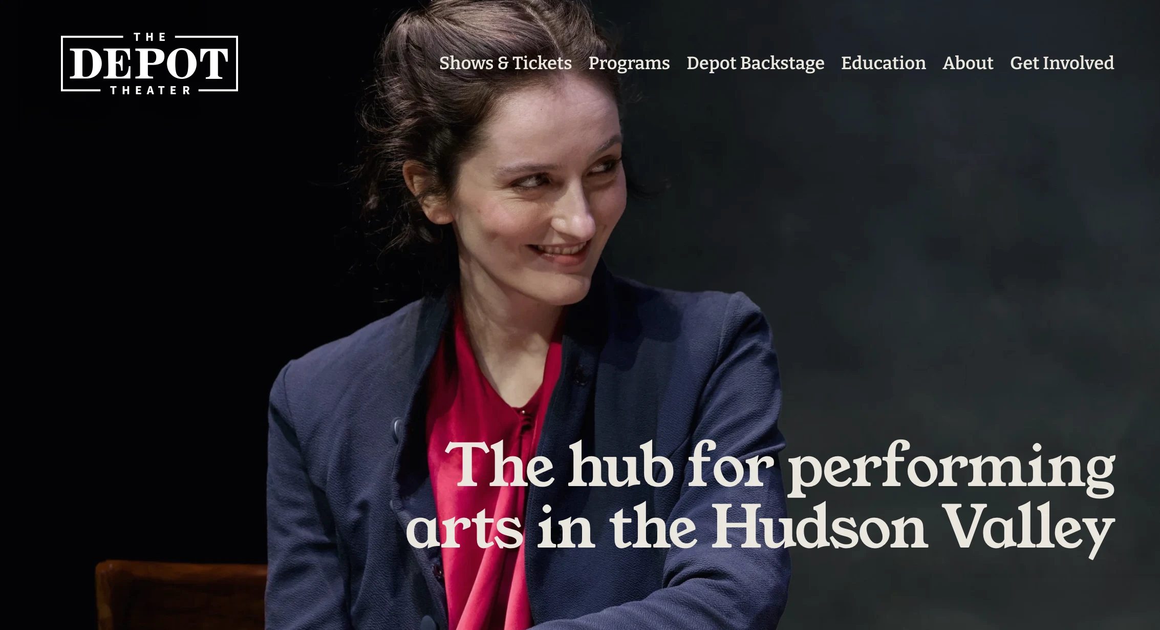 Website Re-design for the Depot Theater by Condensed shows a woman on stage with dramatic lighting looking at someone who is off camera.  Also shows off the new depot theater logo in the top left corner.