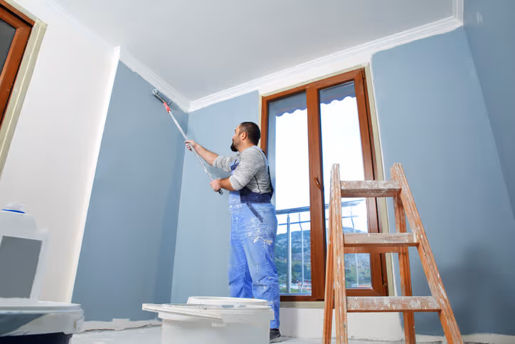 commercial painter painting a room 