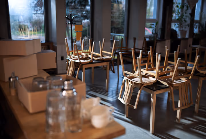Packed boxes in closed cafe, small business lockdown