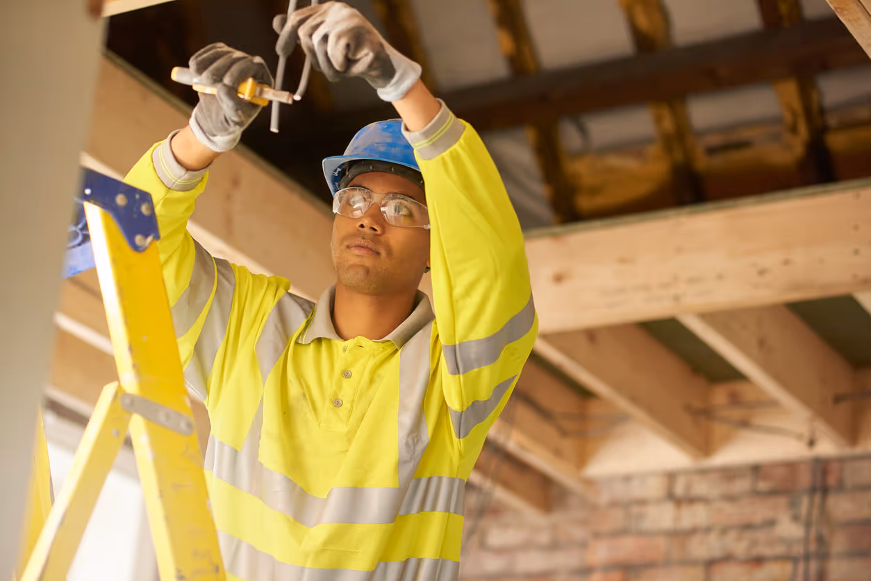 Young electrician working on a remodel - new hampshire electrician insurance concept