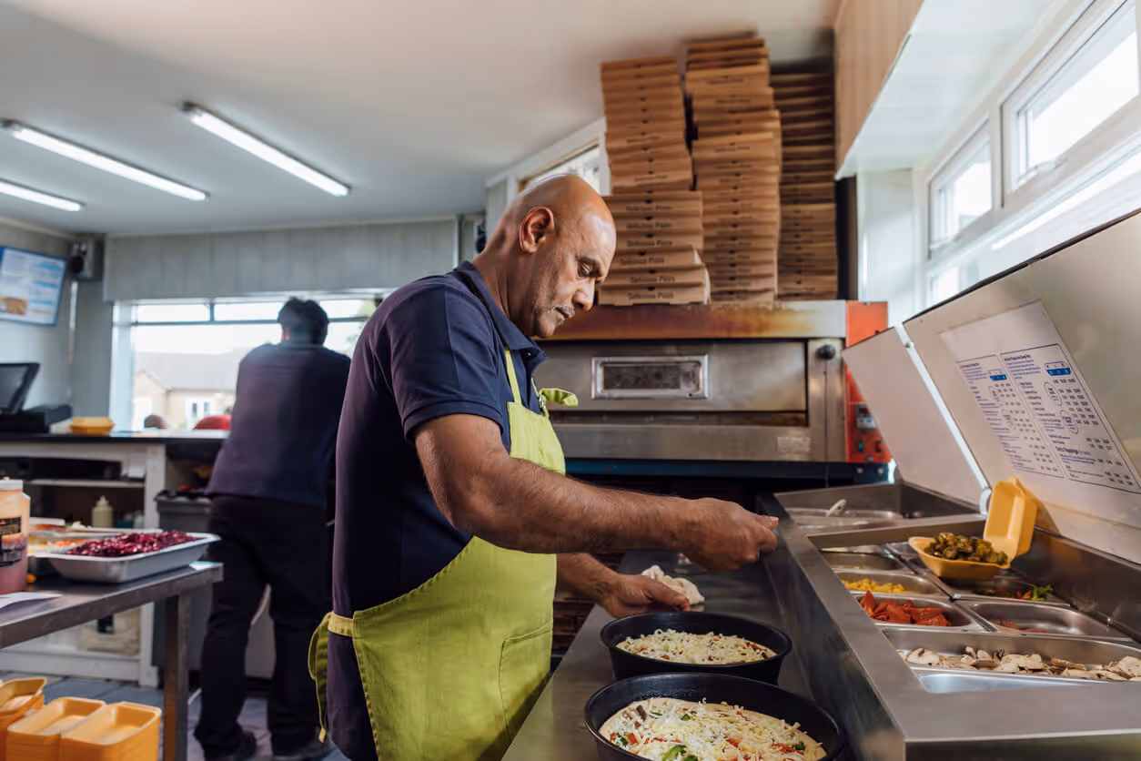 Making Pizzas in the Kitchen - pizzeria insurance in new hampshire concept