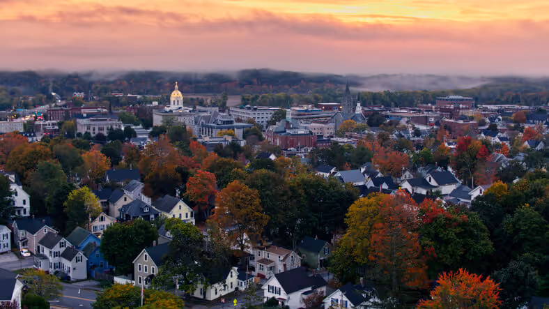 best insurance agency near me in new hampshire concept - Aerial shots of the New Hampshire State House in Concord at sunrise on a misty morning in Fall.
