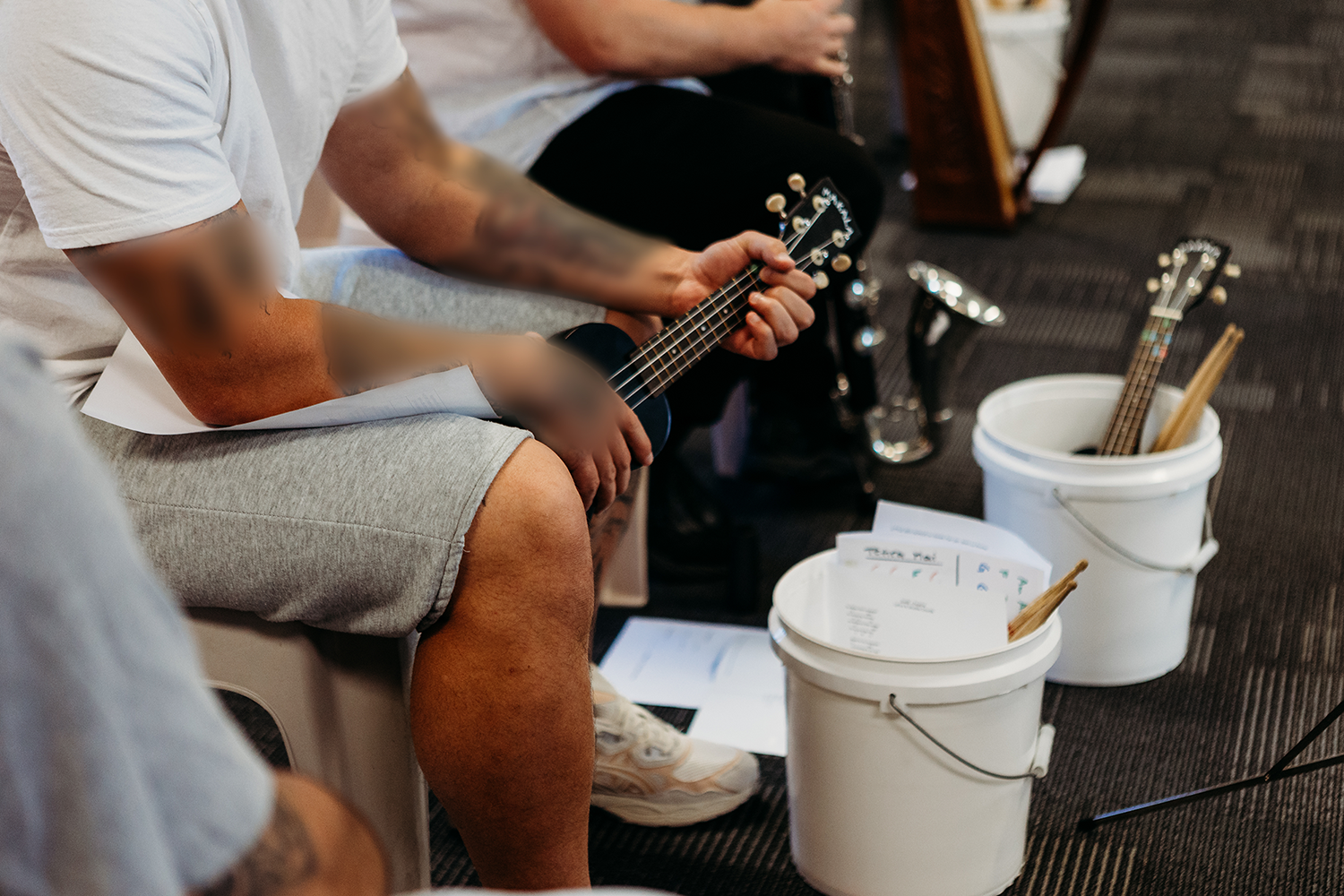 man playing ukulele
