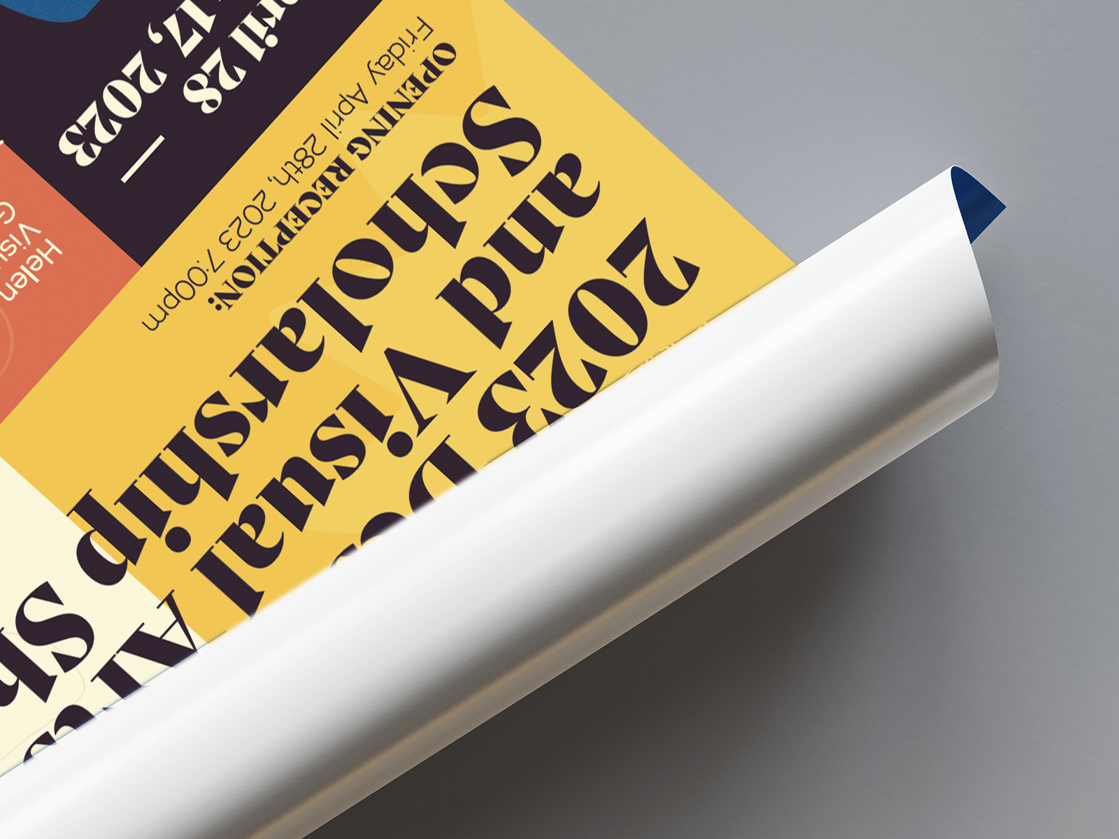 A close up shot focusing on the main headline of the poster reading "2023 Design and Visual Arts Scholarship Show", with the top portion of the poster rolled up.