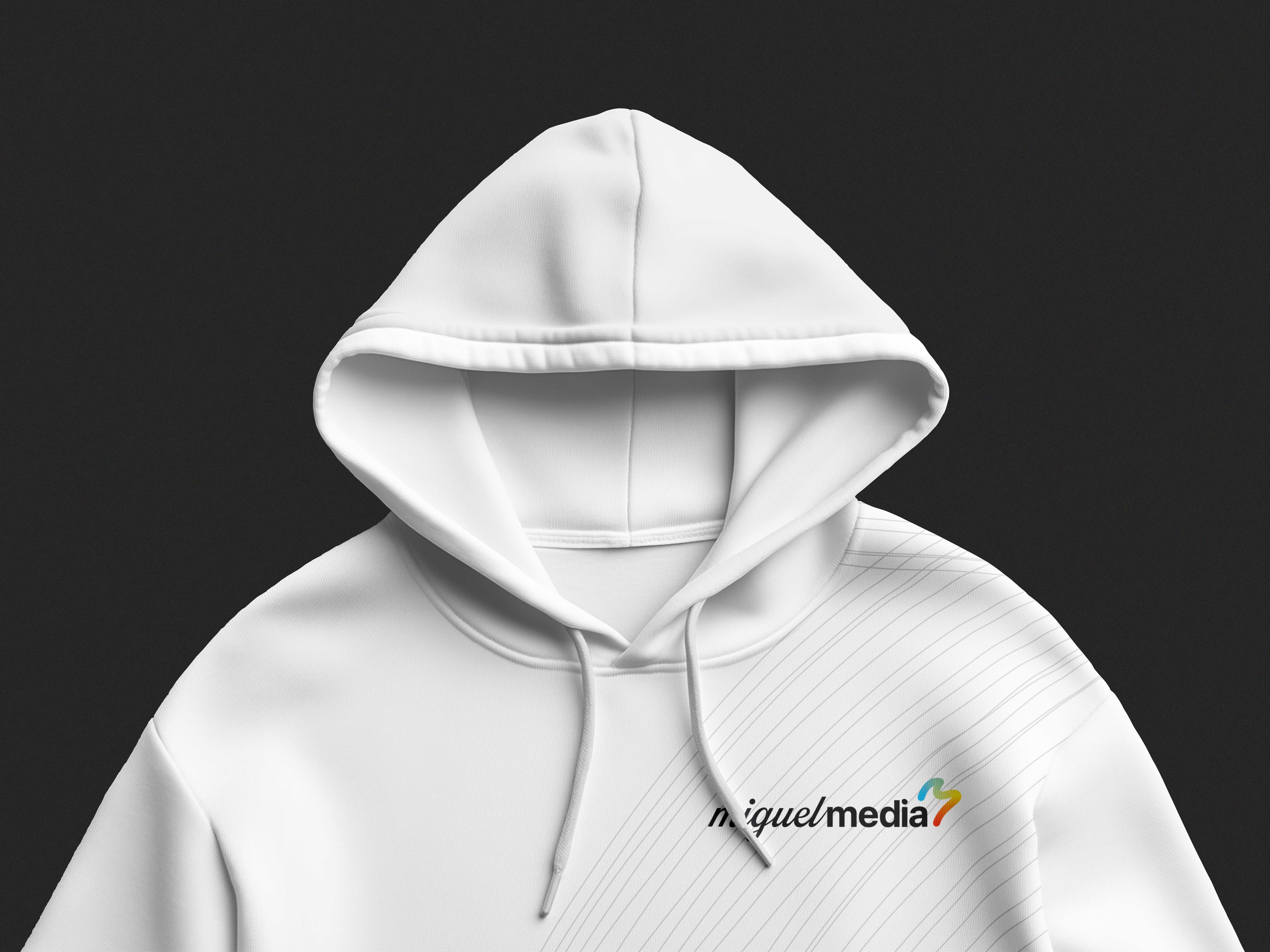 A white sweater with the hoodie up and a small black logo saying "Miguel Media" in the top right.