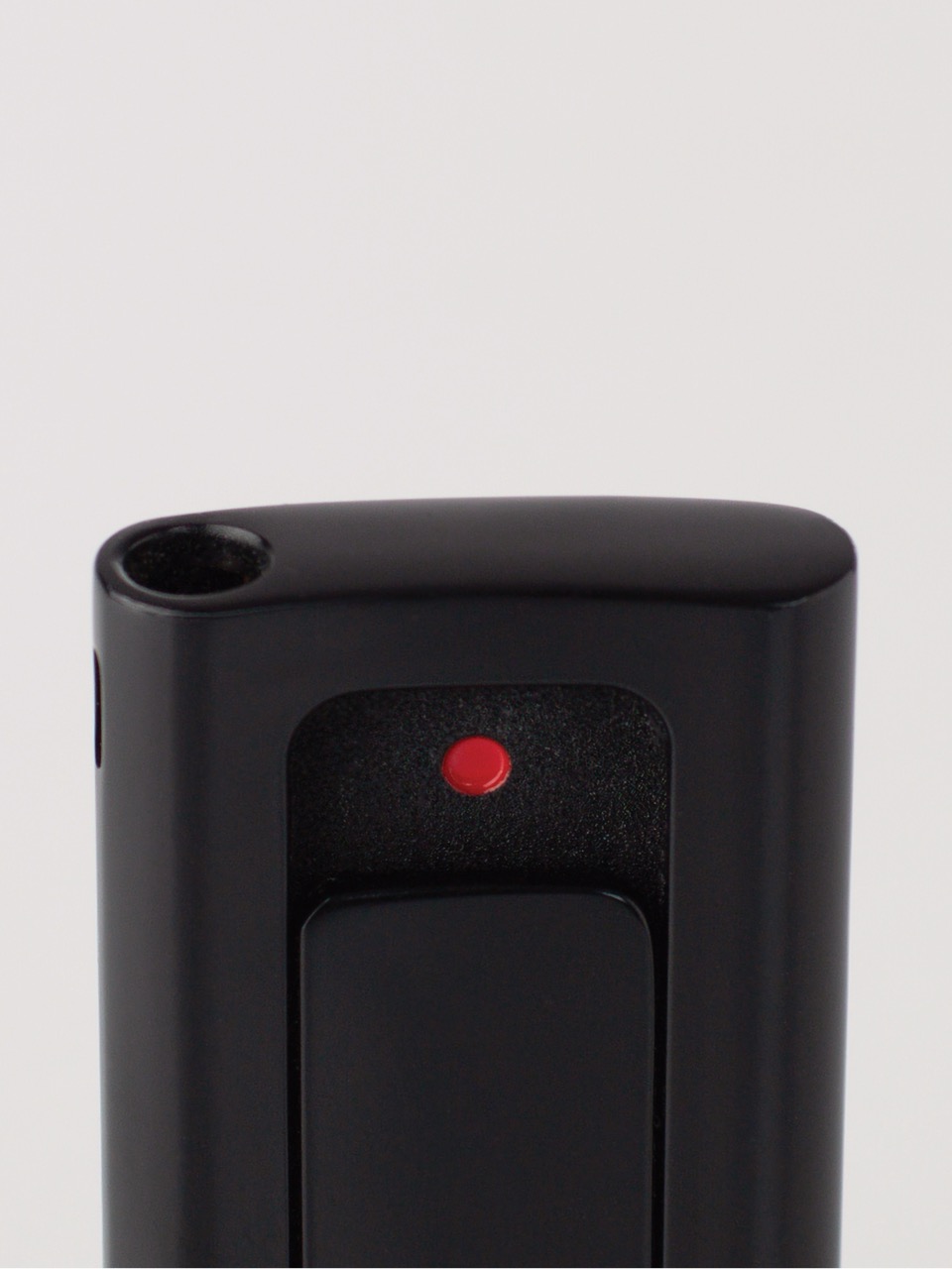 Detail of the Lydian EP Black lighter's ignition switch and orientation dot