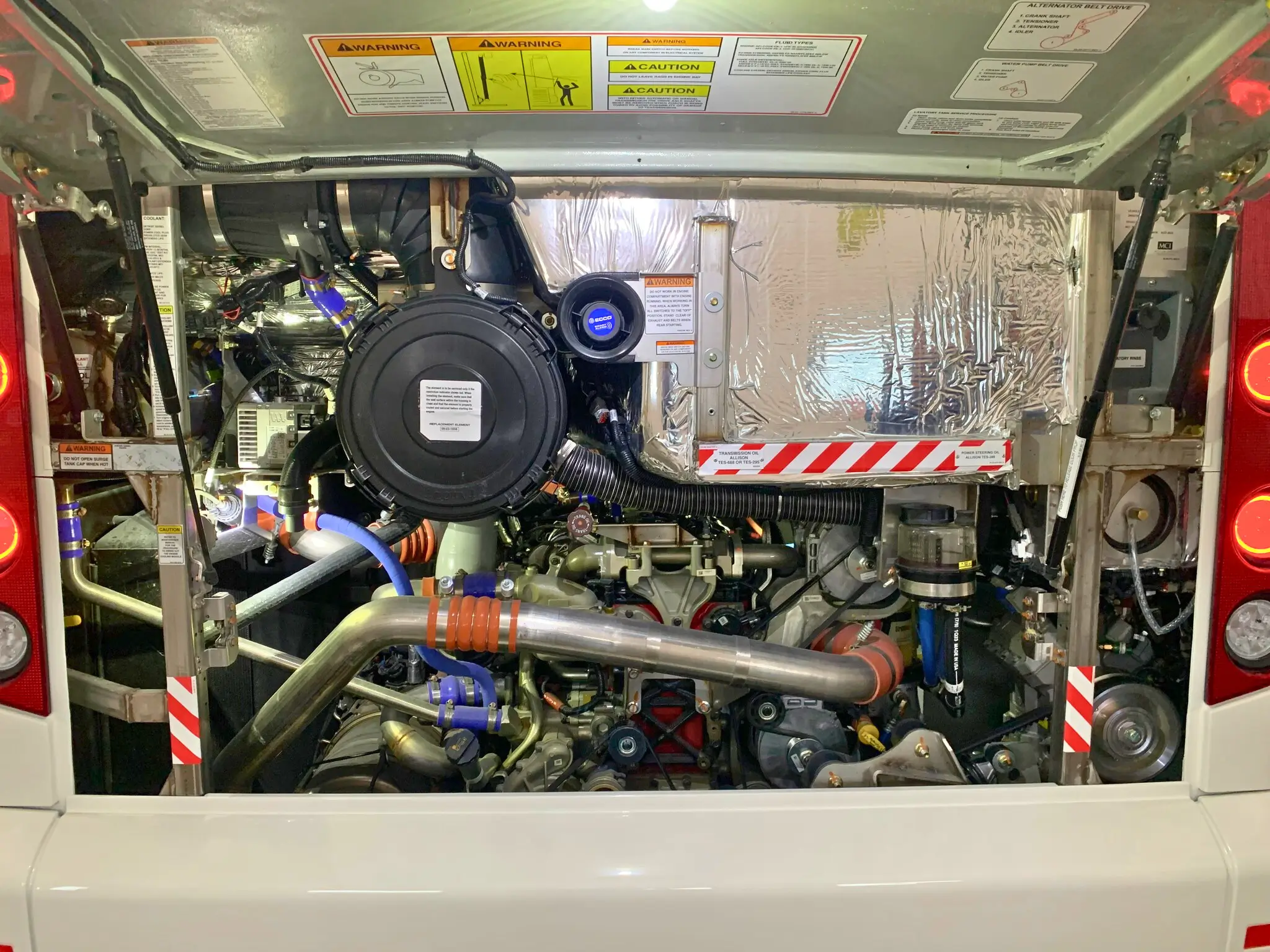 Close-up of the 2026 MCI J4500 motorcoach's Cummins X12 engine, built for performance and reliability.