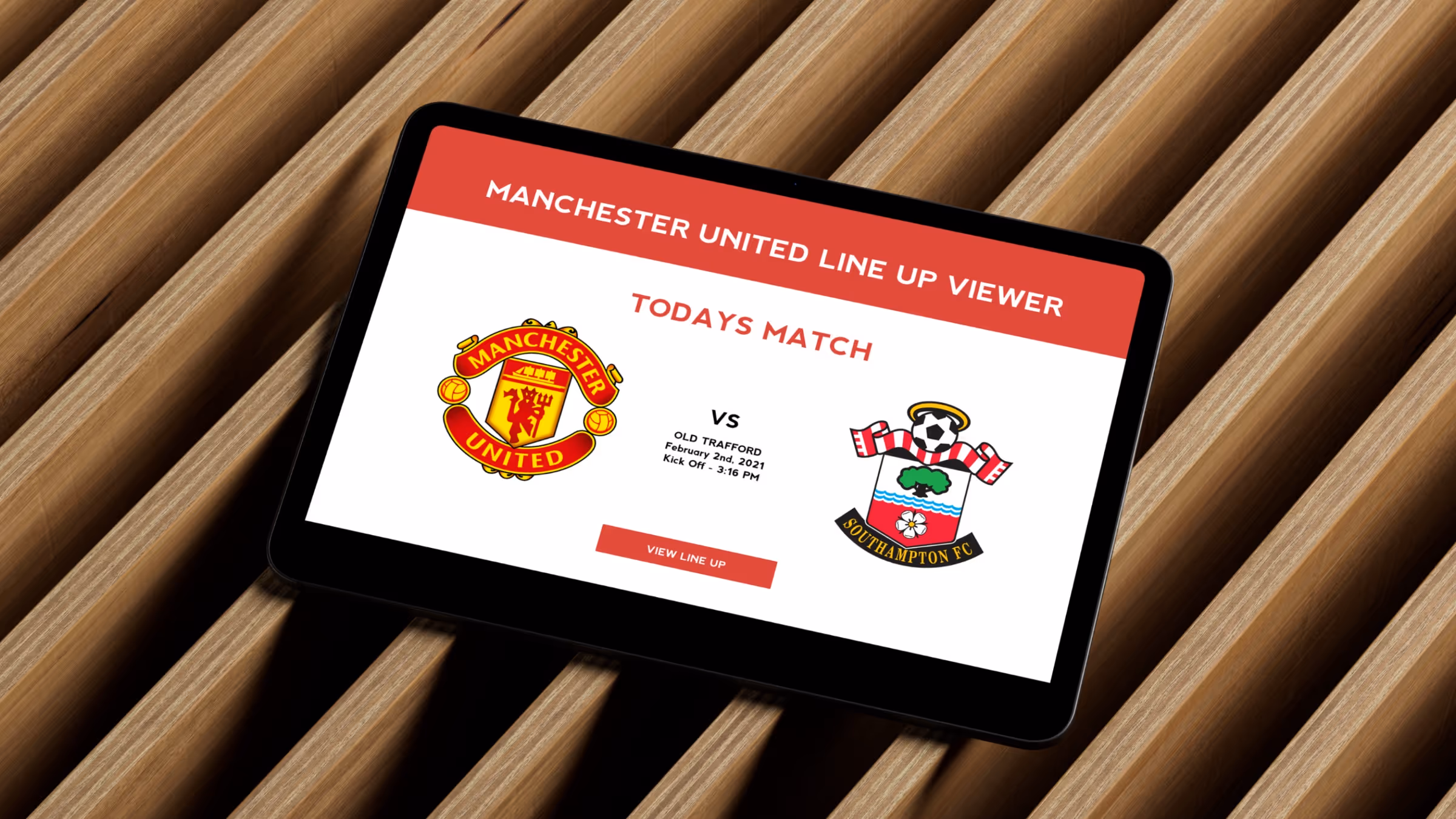Manchester United lineup viewer displayed on iPad against wood slats