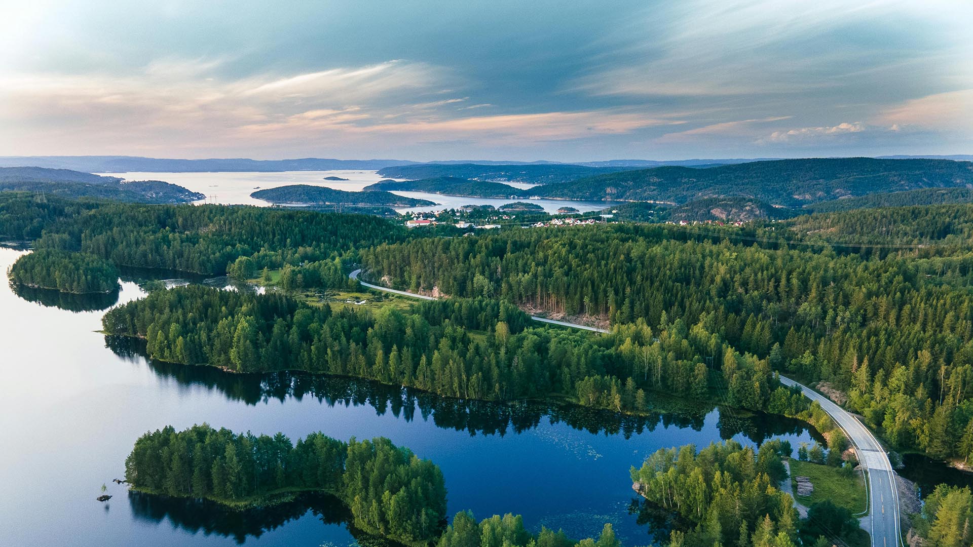 A photo of lakes and green trees in Norway.