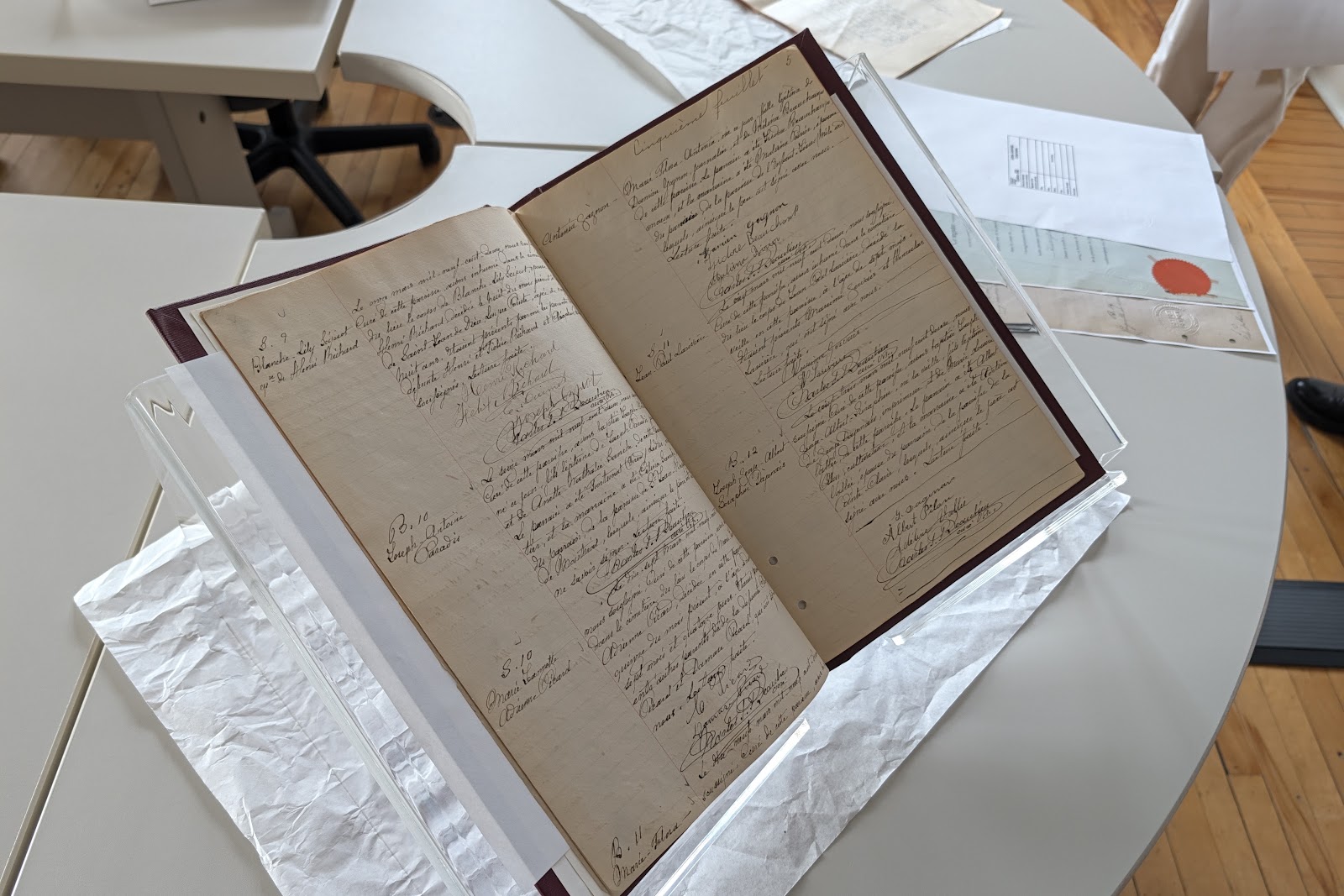 An original handwritten register resting on a protective stand during the BAnQ presentation