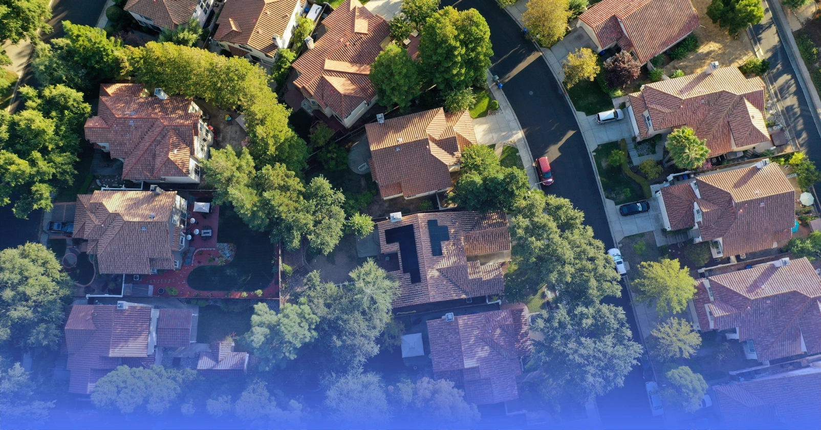 Neighborhood with houses that have solar panels on the roof