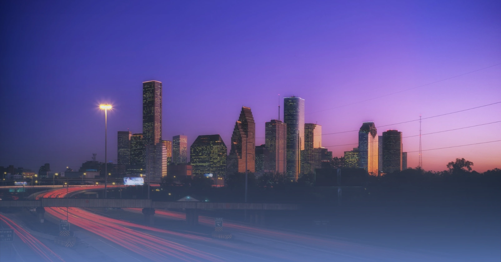 A picture of the city of Houston at sunset, which is where Lonestar Solar Services is headquartered