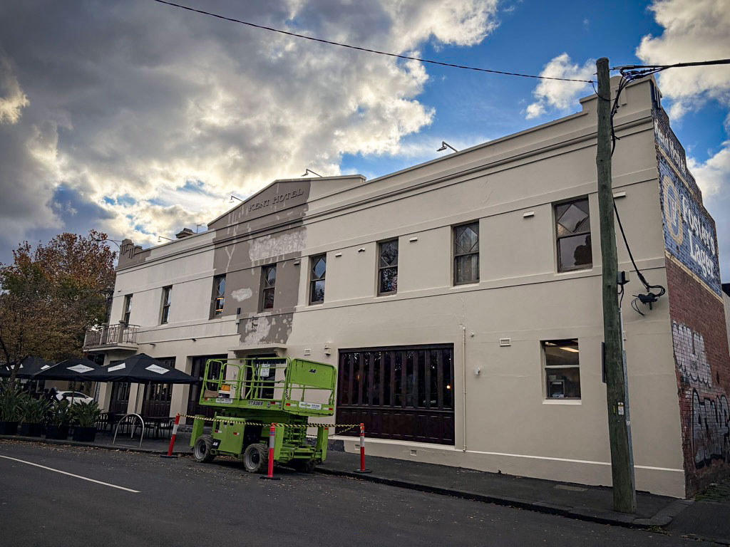 Hotel exterior during renovation, illustrating how external brand signals influence customer perception.
