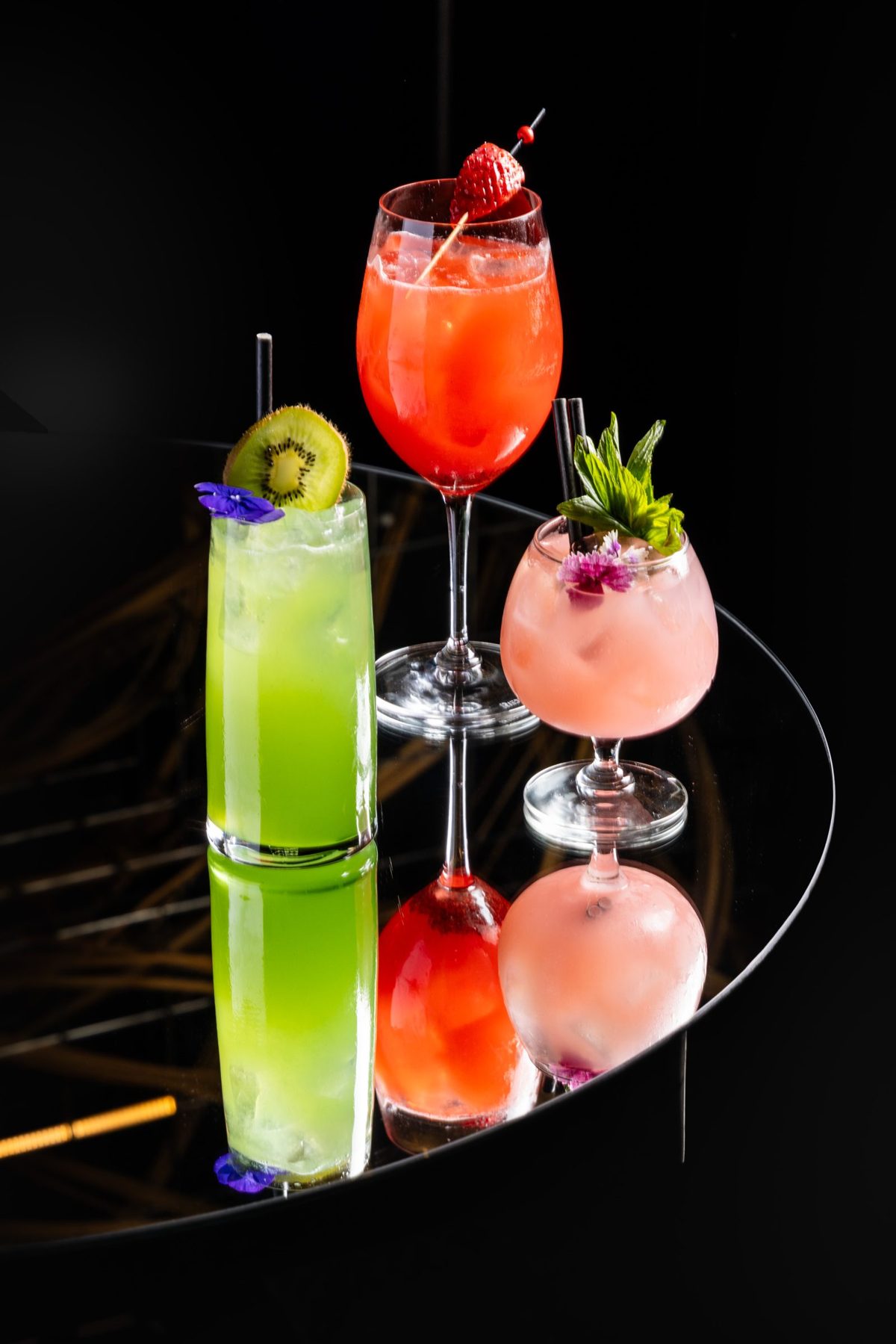 Three drinks from the bottomless list on a mirrored table
