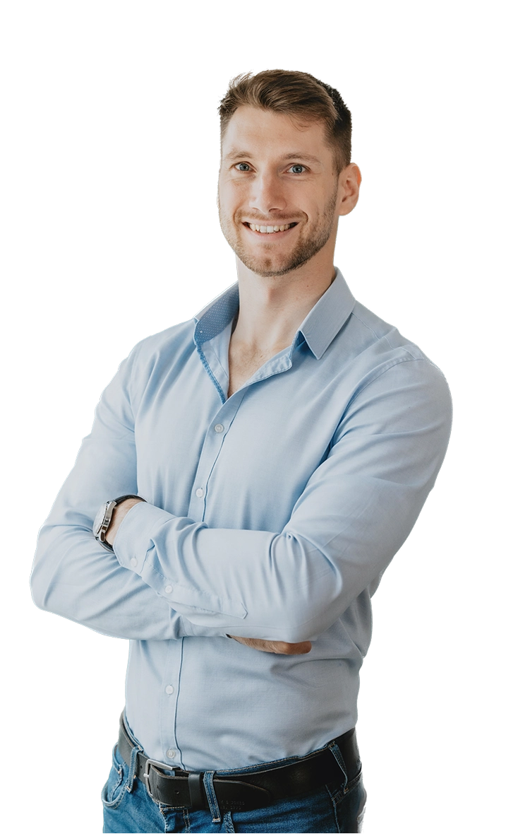 Image of Viktor smiling with his arms folded.