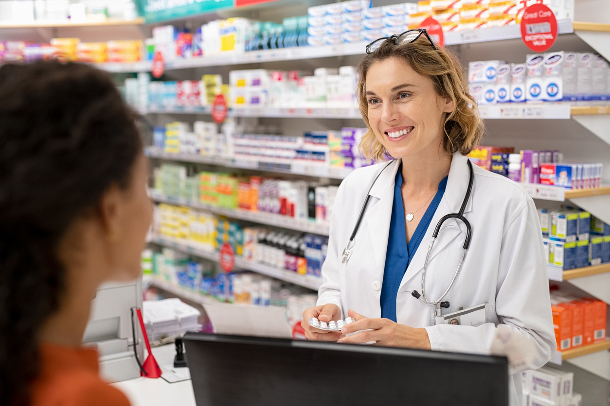 A pharmacist is able to spend longer discussing with a patient thanks to time-saving initiatives. 
