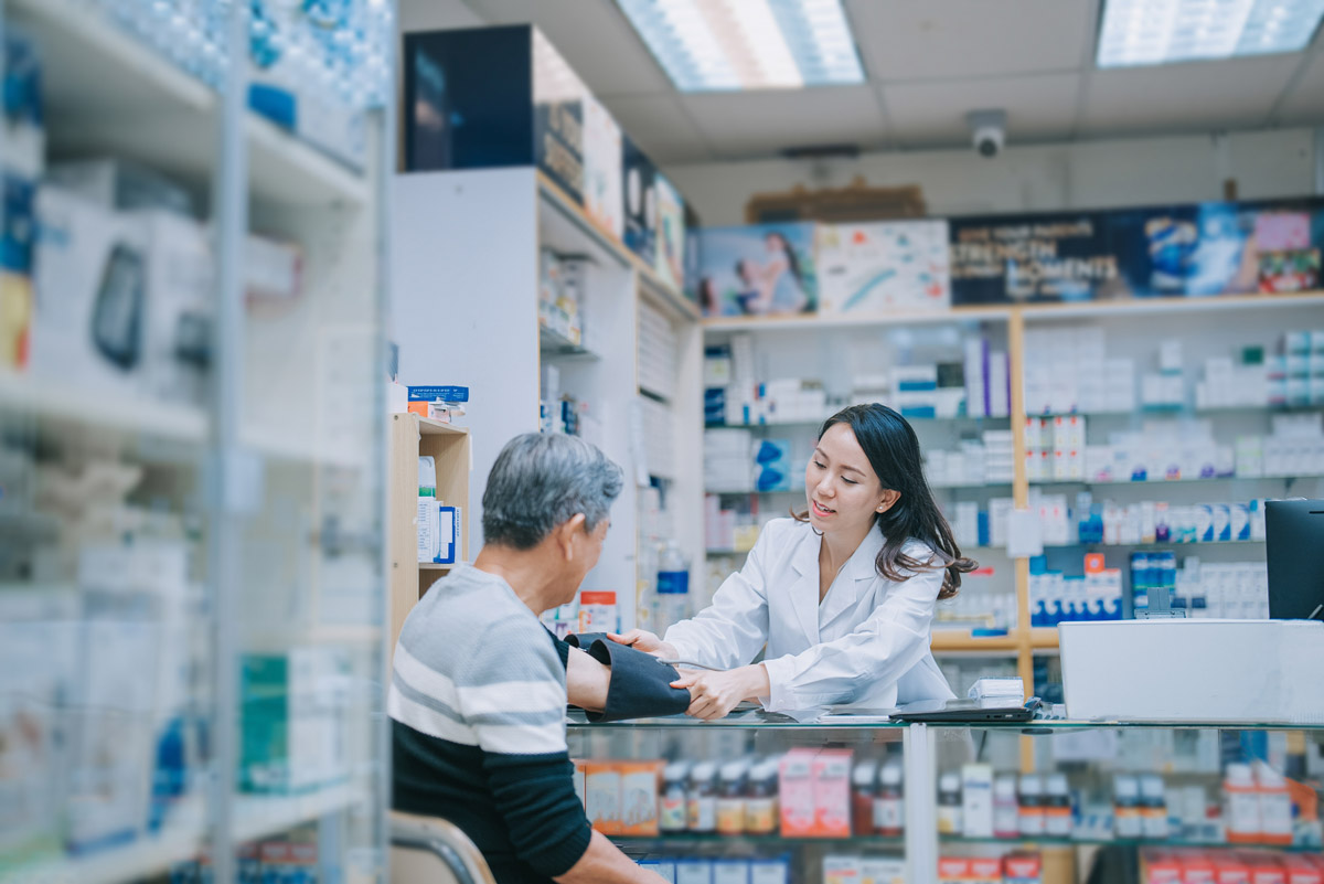 A pharmacist consults with a patient to address their concerns and help with adherence. 