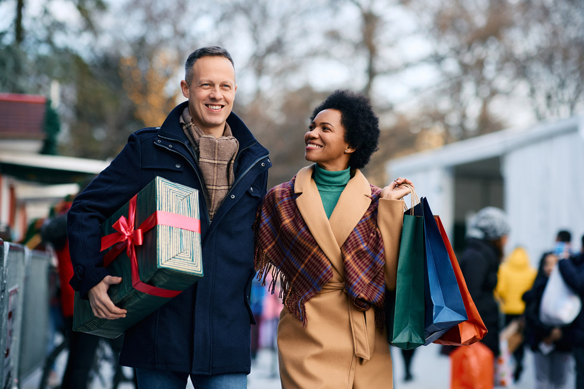 A young couple does their holiday shopping locally. 