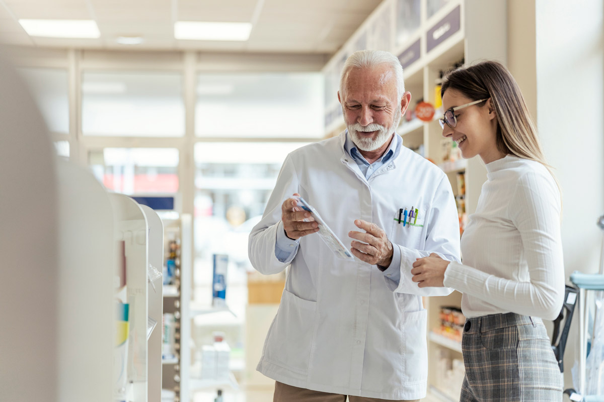 A pharmacist helps a patient with their treatment plan.
