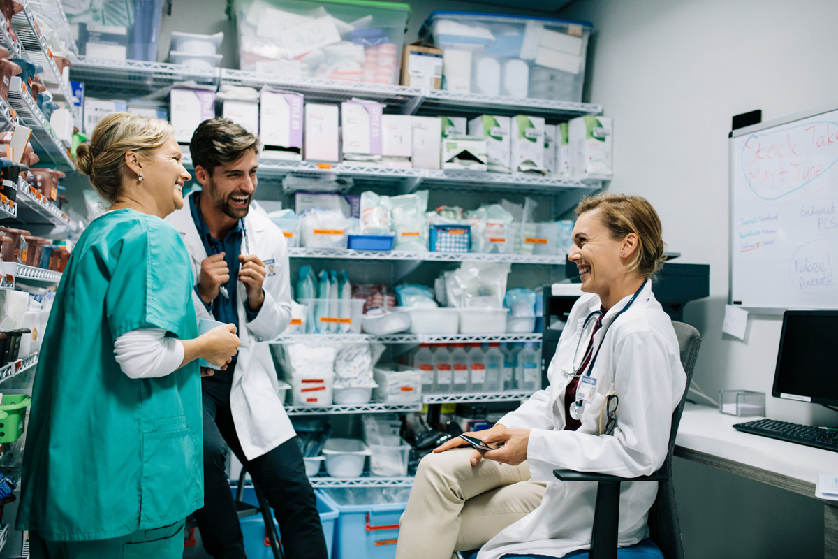 Happy pharmacy staff members collaborate on new patient-facing initiatives. 