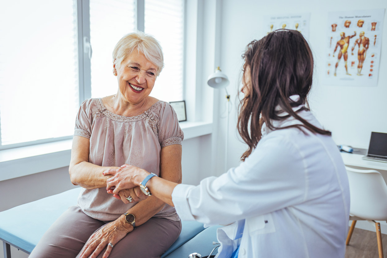 A provider practices patient-centered care with an elderly patient.