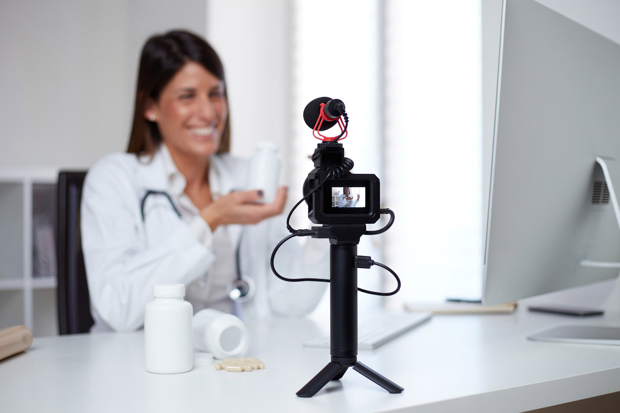 A pharmacy owner films educational video content for her practice's social media.