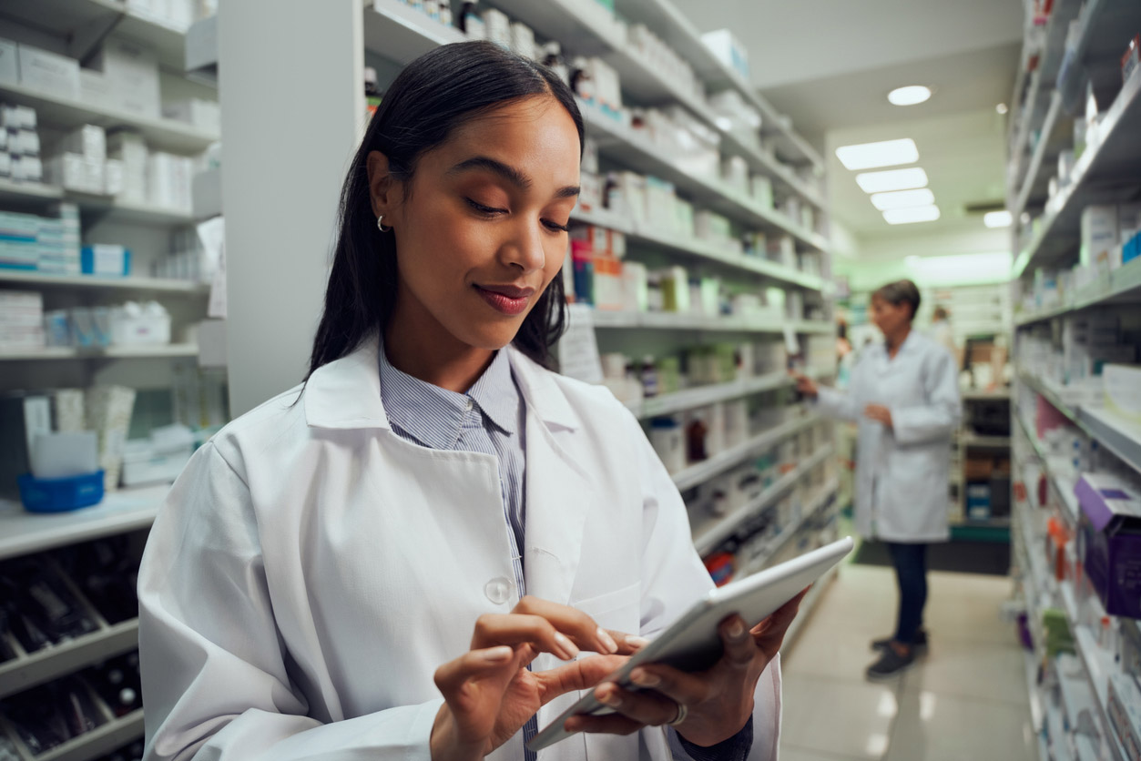 A pharmacy tech works on improving the practice's workflow.