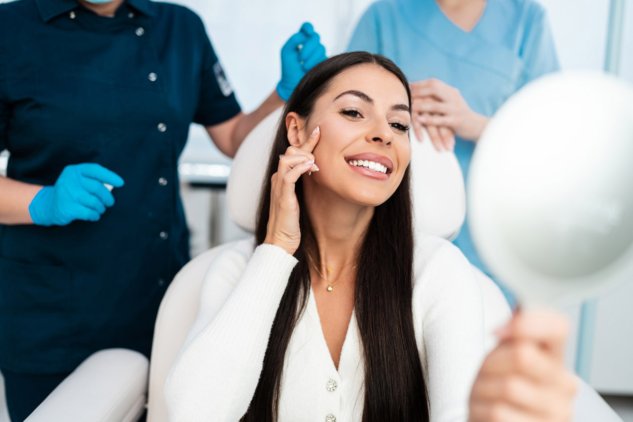 A woman has a consultation with her dermatologist about getting fillers.