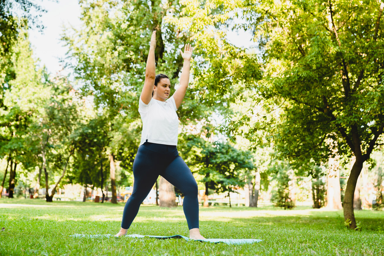 A woman who takes a GLP-1 does exercises outdoors.