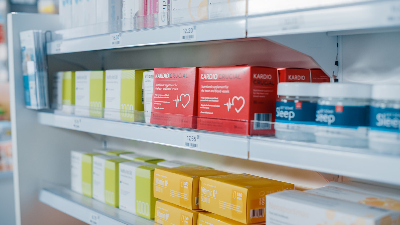 A pharmacy has products displayed on shelves with clear, educational labels to better market the products and boost sales.