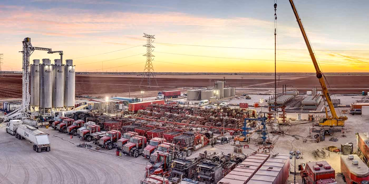 A multitude of fleets and oil tools near a downhole completion project.