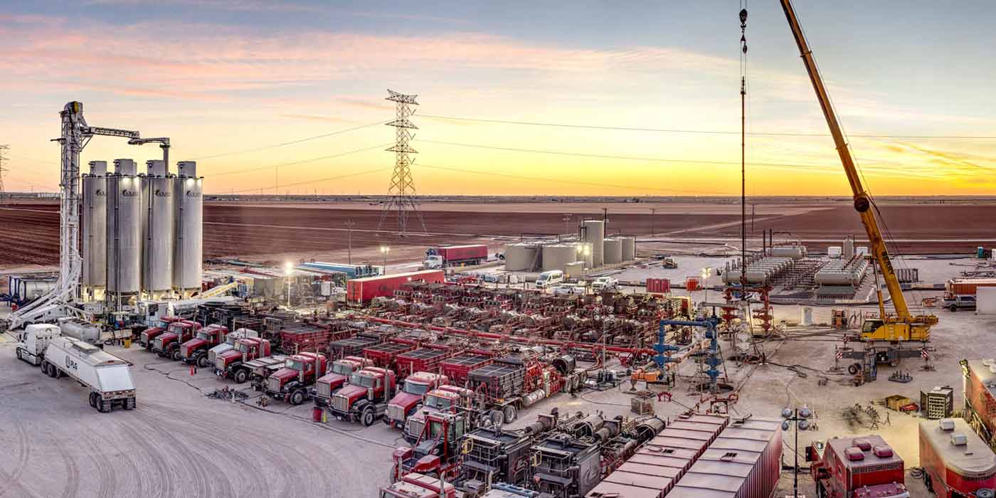 A multitude of fleets and oil tools near a downhole completion project.