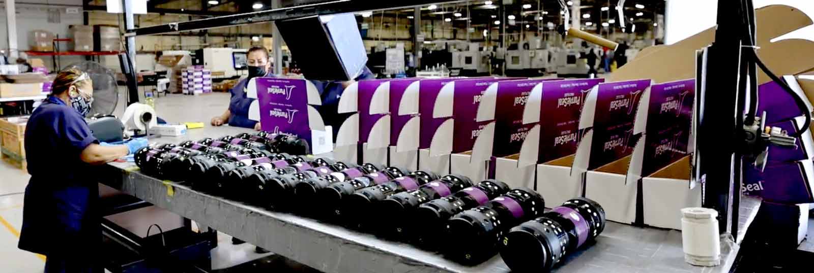 A line of PurpleSeal Frac Plugs on an assembly line ready to be boxed.