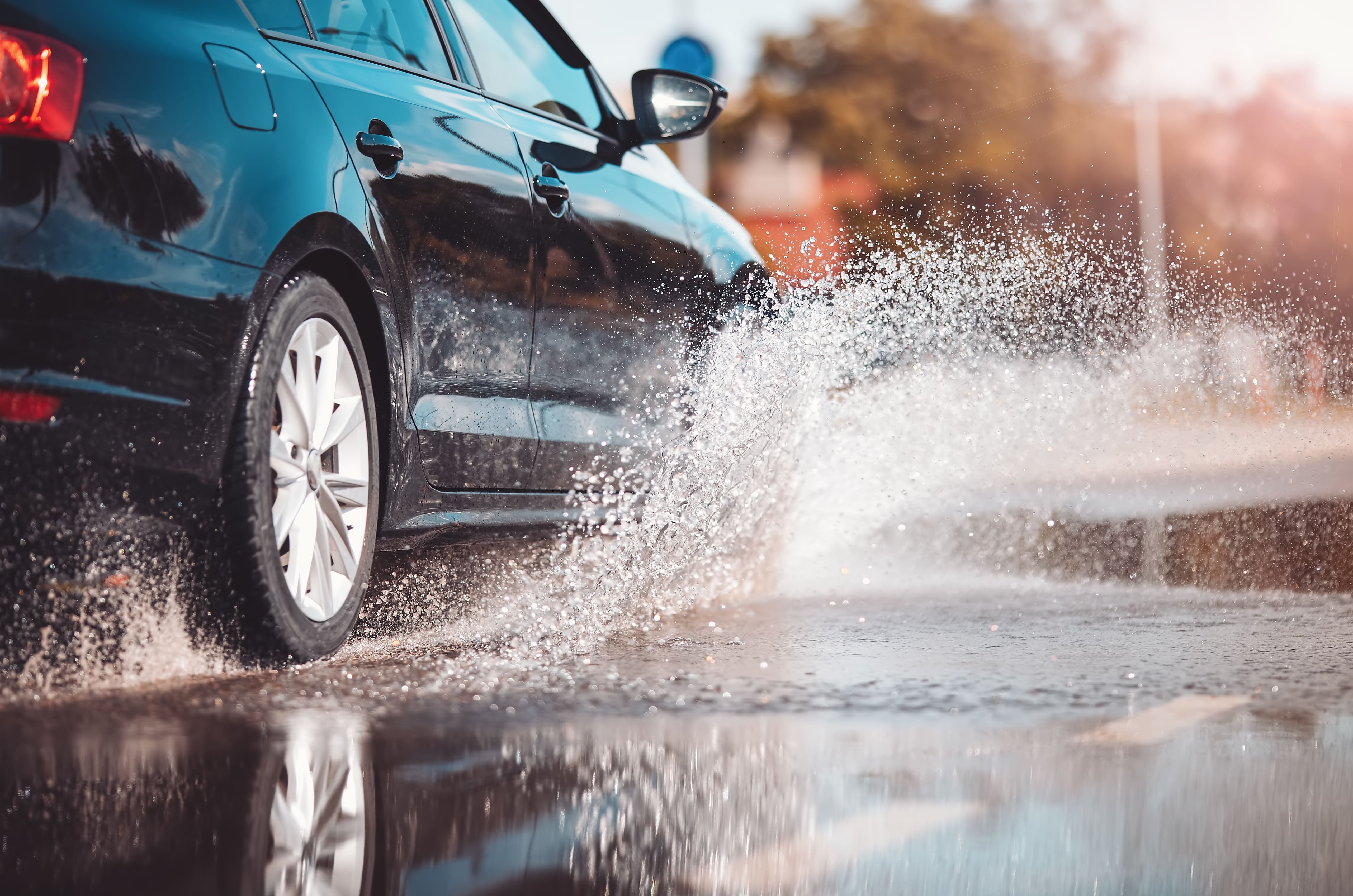 Car passing through a puddle of water