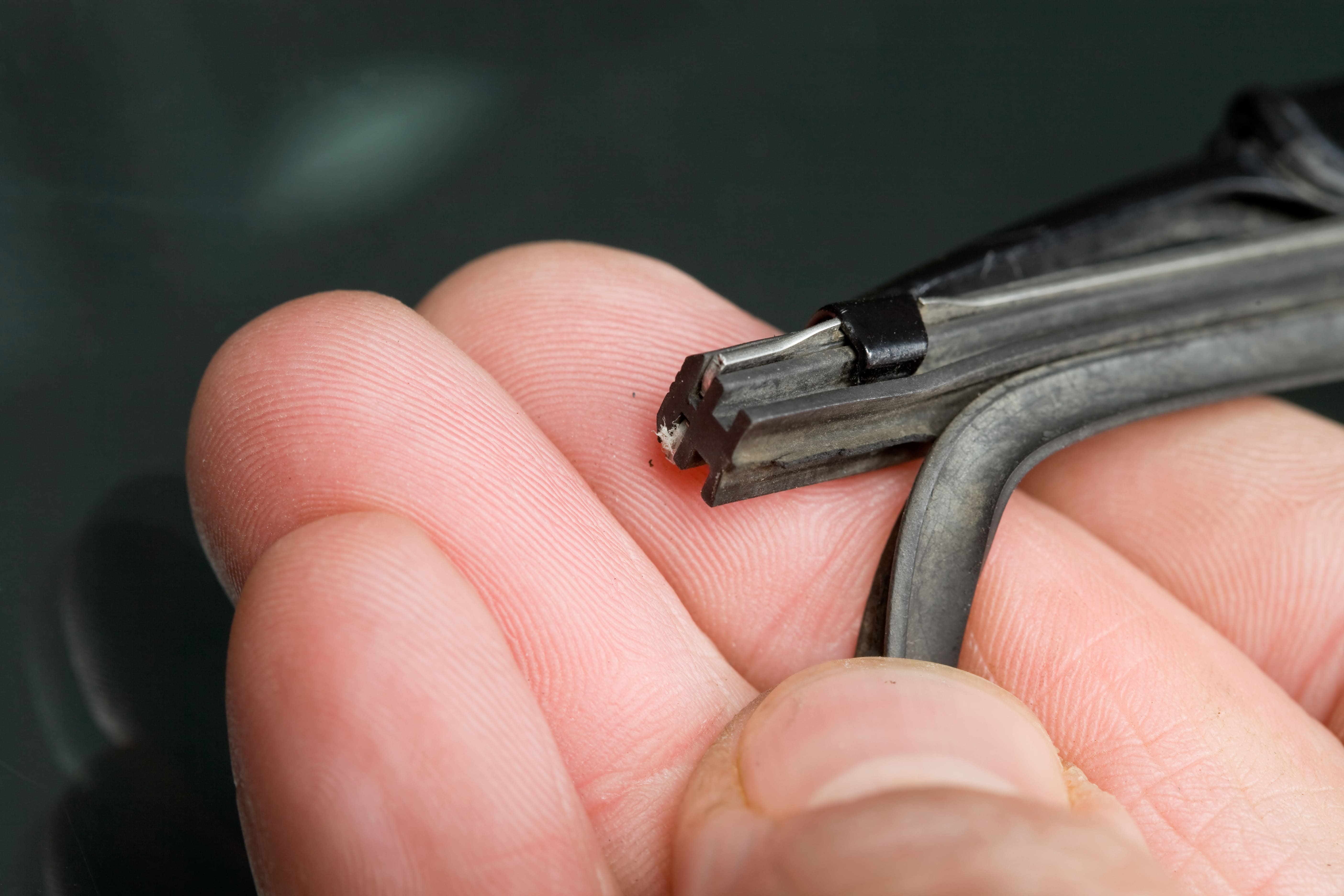 Person holding a car part