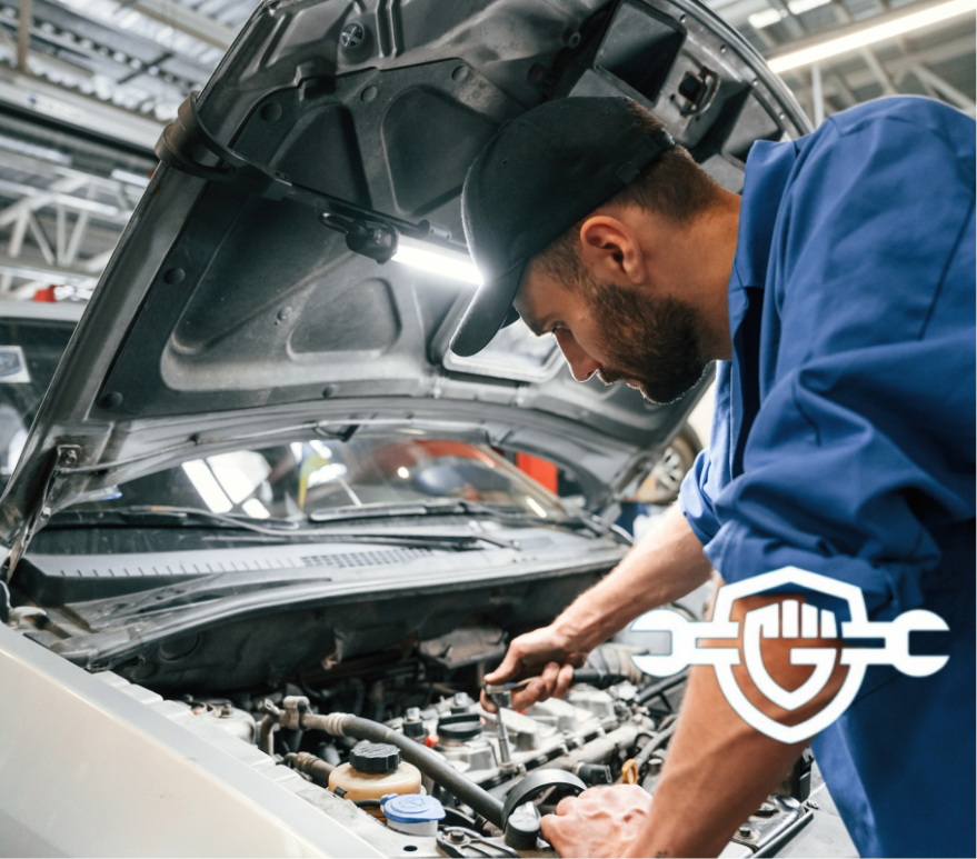 mechanic working on the engine of a car improving cold air intake