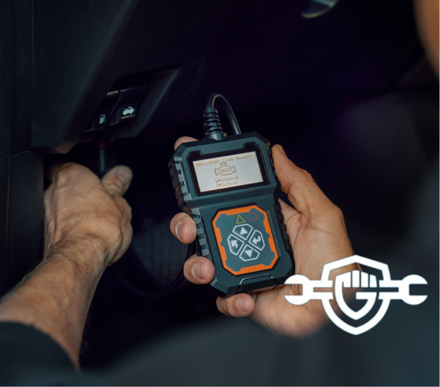 car mechanic using OBD2 scanner, code reader tool to check engine errors and for diagnostics