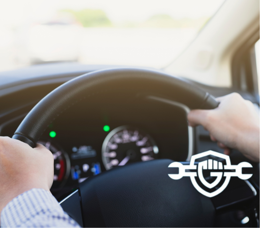image man while driving in a car hands on the wheel