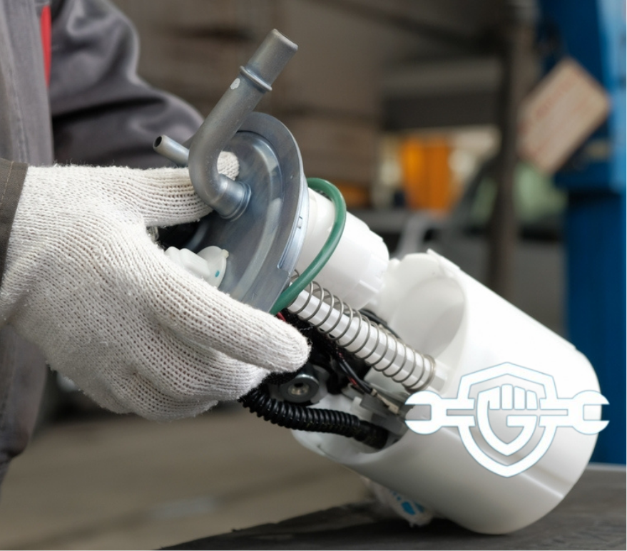 An auto mechanic holds a new fuel pump in his hands. Repair of the fuel and exhaust system of the car in the service station.